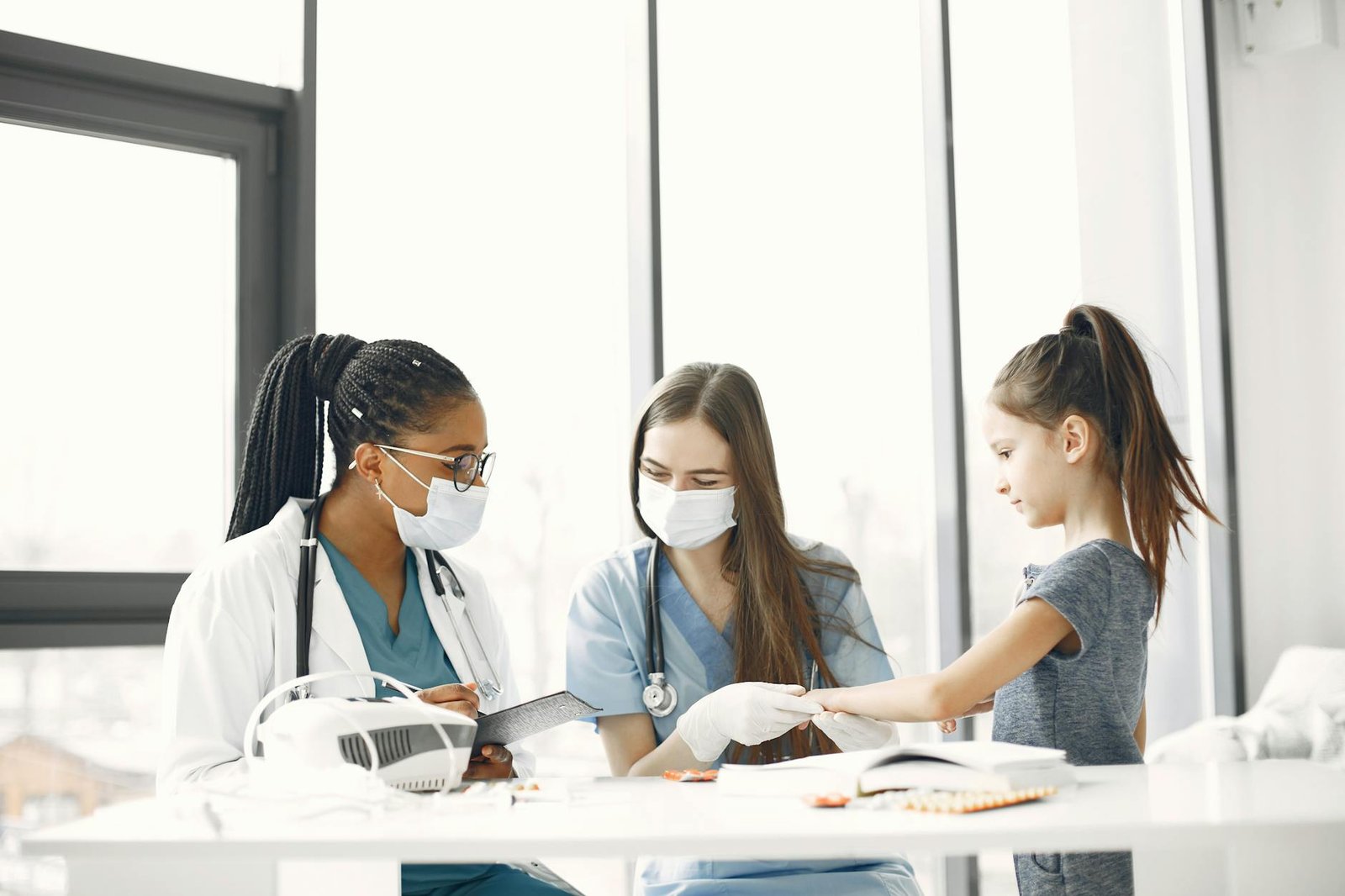 Healthcare professionals attending to a child